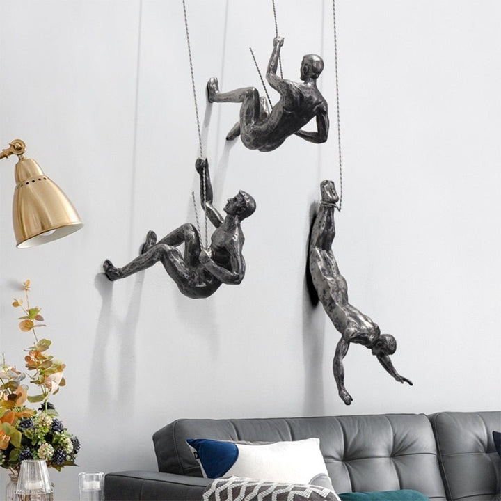 Modern metal-look climber wall sculpture, unique artistic home decor.