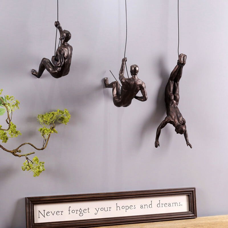 Dynamic handmade climbing figure art, perfect for modern living room decor.