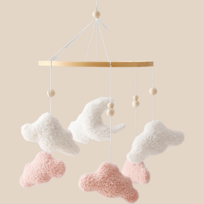 Handmade cloud baby mobile with neutral felt clouds for crib or nursery decor, ideal newborn gift.