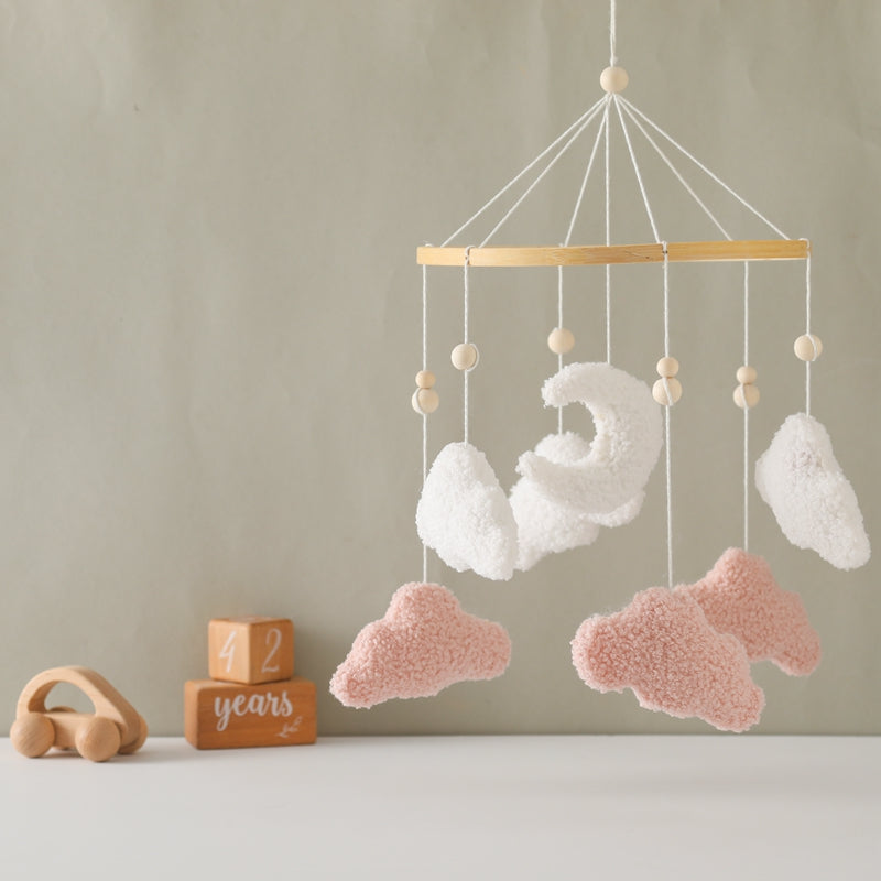 Soft cotton baby mobile featuring white and grey clouds, perfect for a gender-neutral nursery.