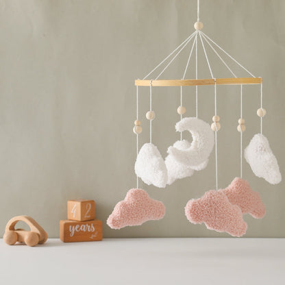 Soft cotton baby mobile featuring white and grey clouds, perfect for a gender-neutral nursery.