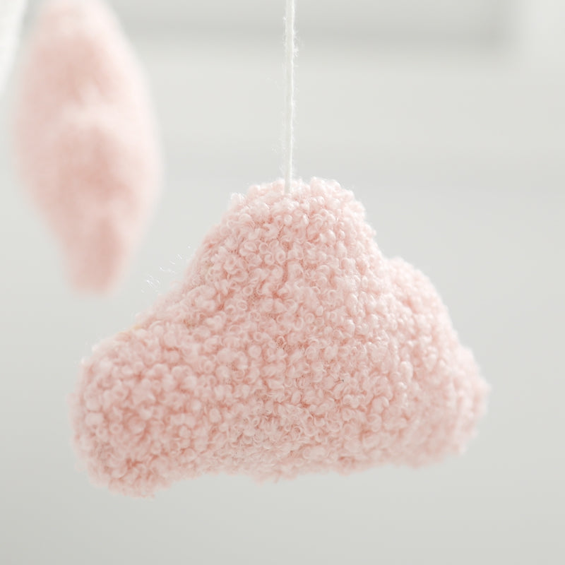 Close-up of a cloud baby mobile showing detailed felt clouds, great baby shower gift inspiration.