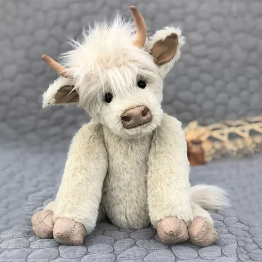 Handmade Highland cow plush toy, crafted from soft alpaca fur, a cuddly Scottish-themed stuffed animal for all ages.