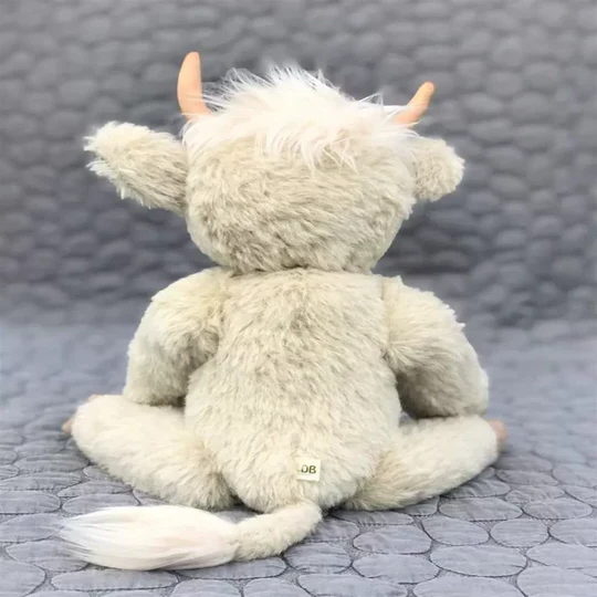 Adorable handmade Highland cow stuffed animal, a unique alpaca fur plush toy and collectible Scottish gift.