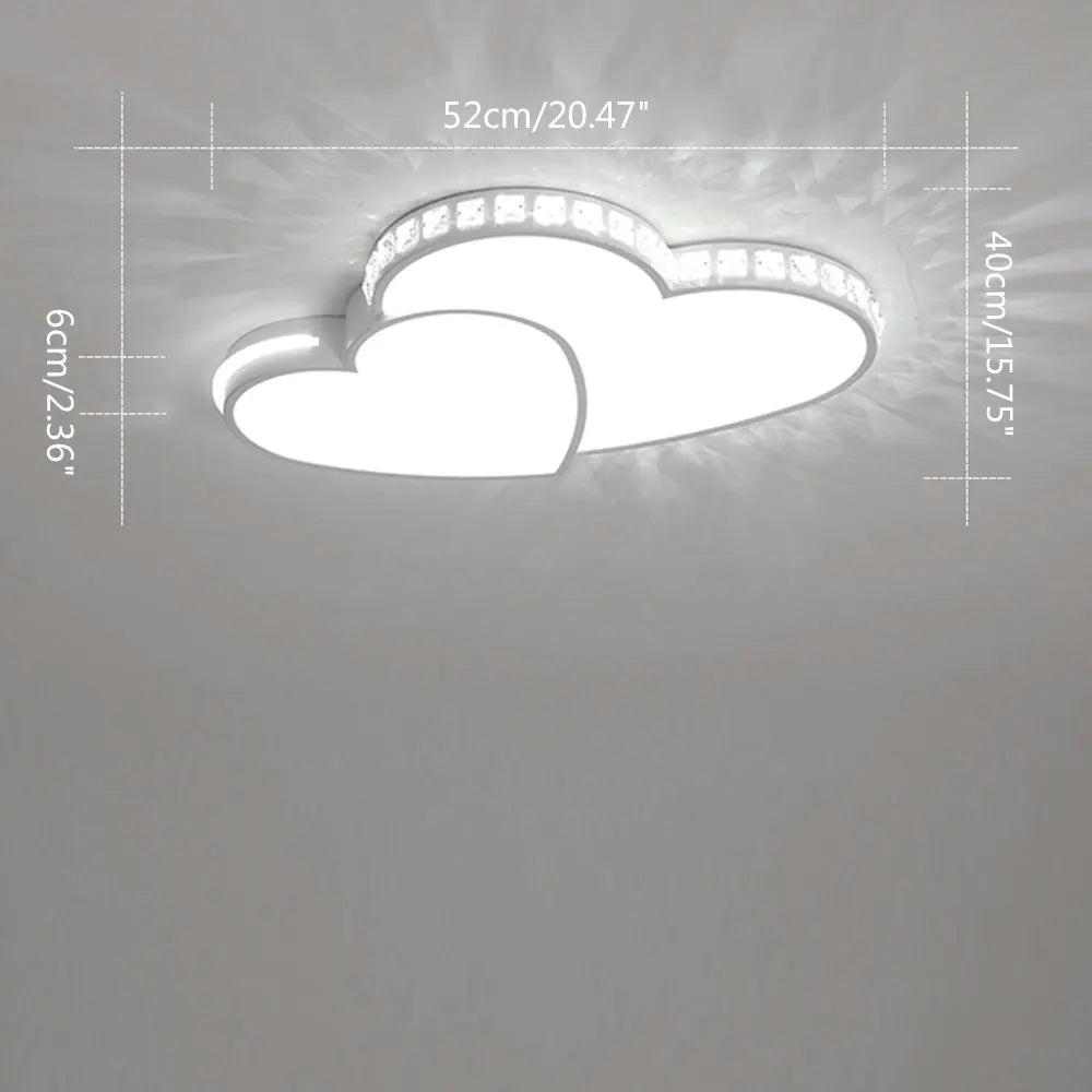 Decorative heart-shaped LED ceiling fixture with sparkling crystals, a charming nursery lamp.