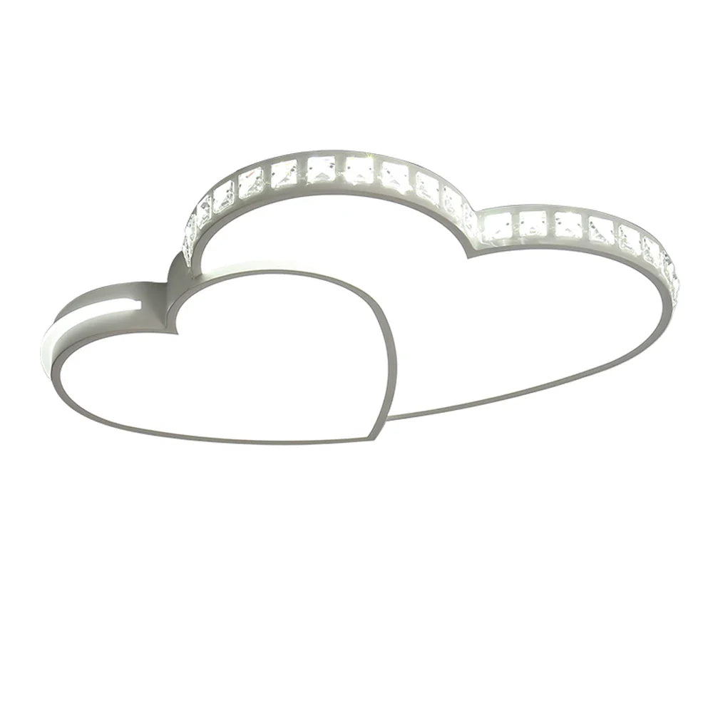 Contemporary heart design LED ceiling light with crystal elements, flush mount for kids' rooms.