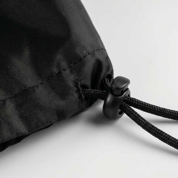 Round grill cover offering heavy-duty outdoor protection for kettle BBQs. Weatherproof, durable patio accessory.
