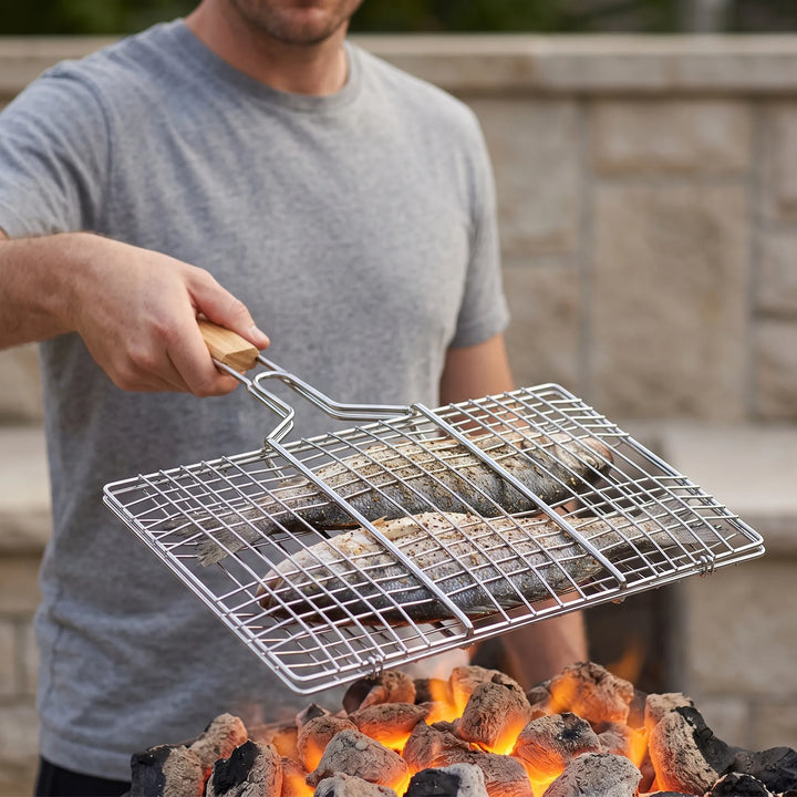 Hinged outdoor grilling basket for easy flipping of vegetables, fish, or meats on BBQ or campfire.