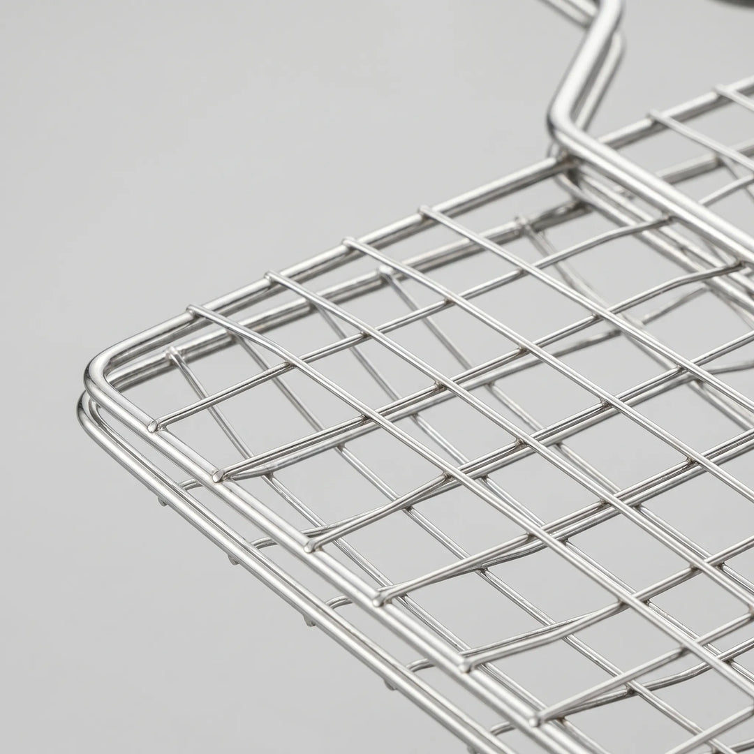 Hinged vegetable grilling basket for perfectly cooked veggies on your outdoor BBQ or campfire.
