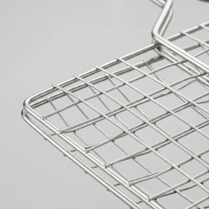 Hinged vegetable grilling basket for perfectly cooked veggies on your outdoor BBQ or campfire.