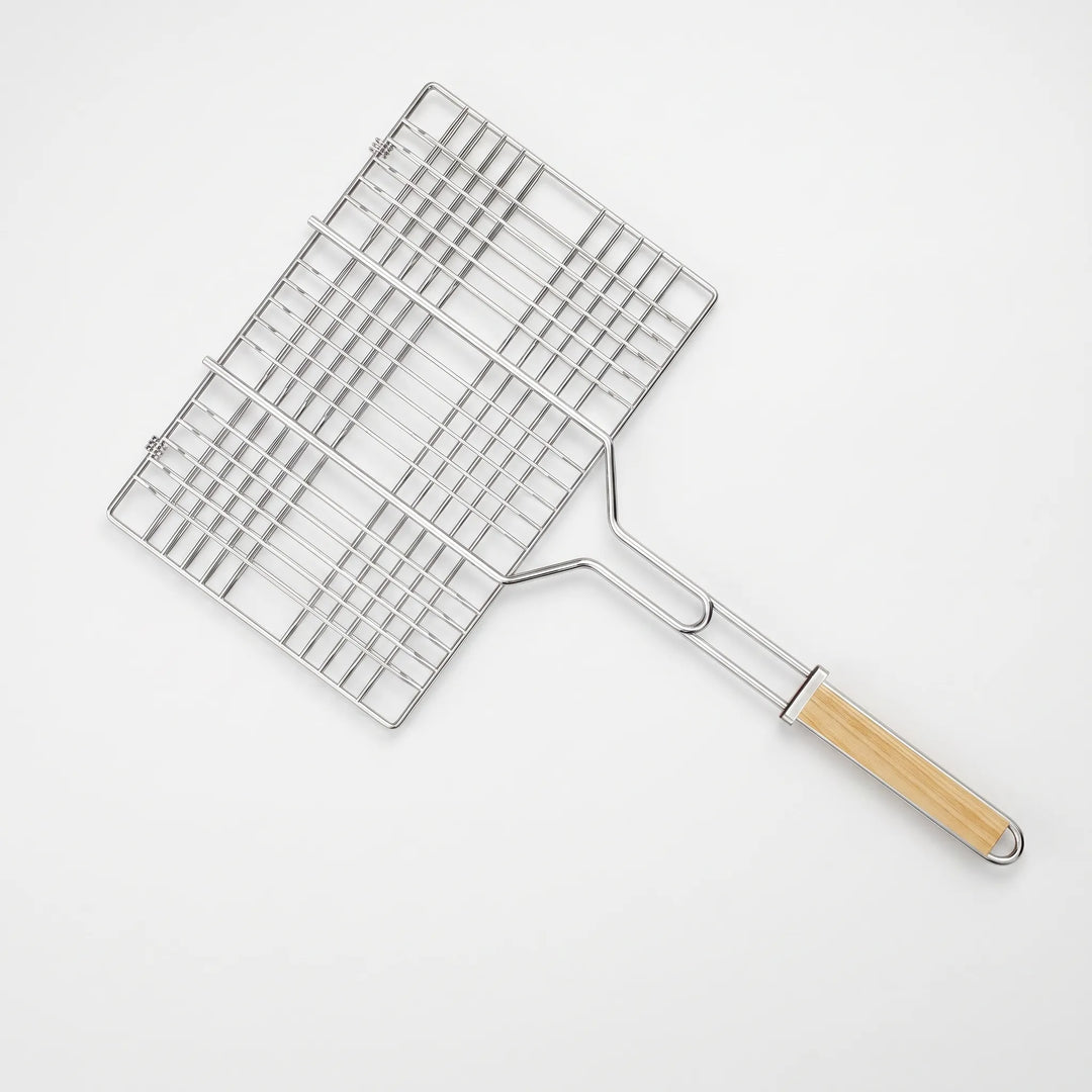 Innovative hinged grilling basket makes flipping meat, fish & veggies on outdoor BBQs simple and mess-free.