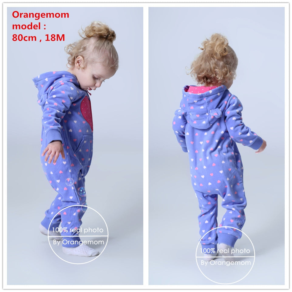 Baby in a hooded rainbow cloud dotted jumpsuit, showing full cozy and stylish infant wear