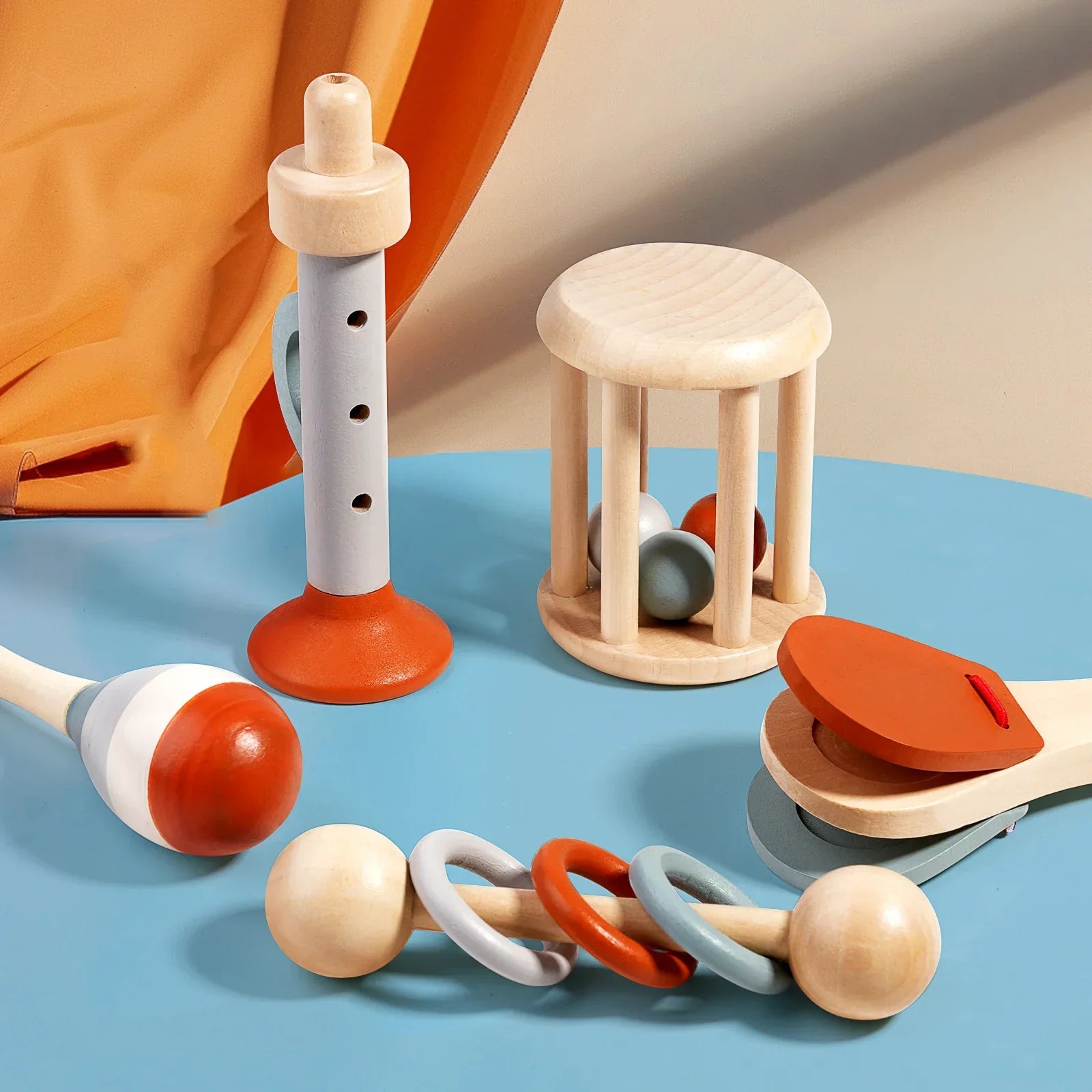 Close-up of Infant Bell Soft Sounds Montessori musical instrument, a safe wooden rattle for infants