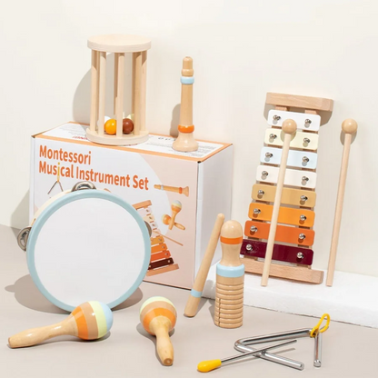 Hand holding an Infant Bell Soft Sounds musical rattle, showcasing a Montessori wooden baby toy