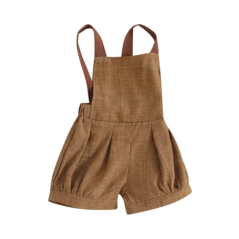 Toddler boy's denim jumpsuit, sleeveless with patchwork accents, ideal for play