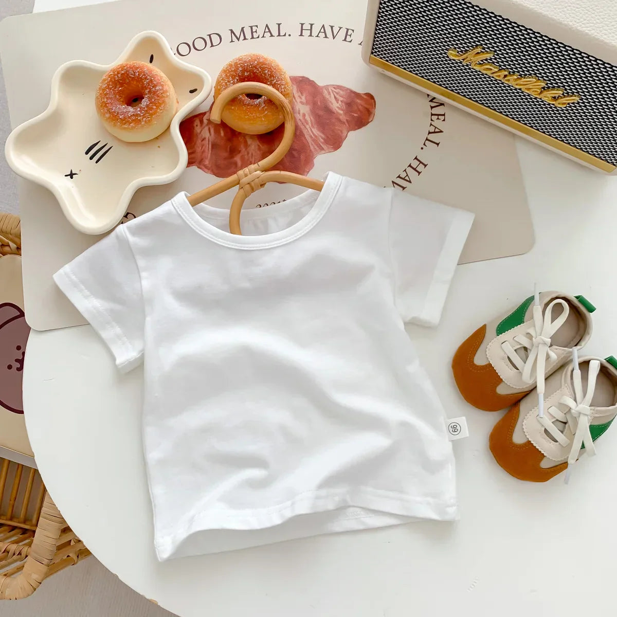 Front view of newborn frog design cotton romper set with integrated feet and cap, cozy baby clothes.