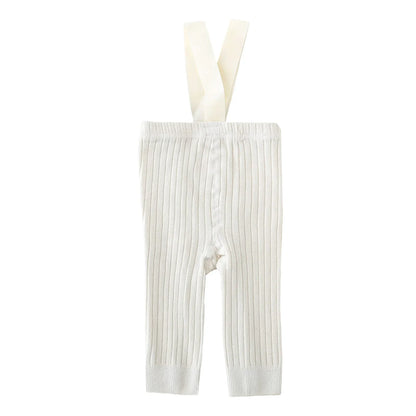 Back view of infant girl ribbed knit overalls, showing crisscross suspenders for a cute toddler fashion look.