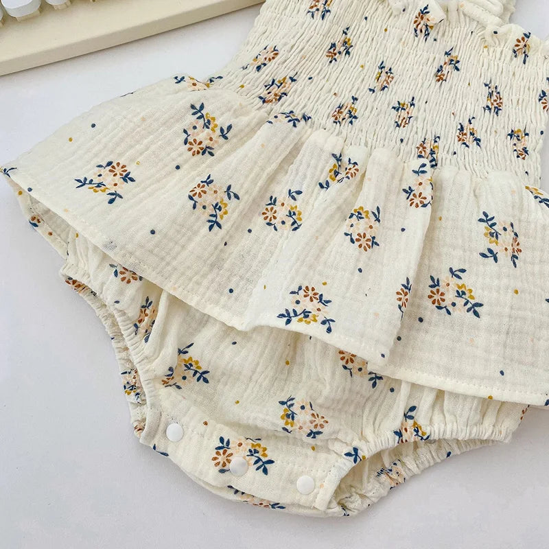 Charming floral pattern on a soft cotton baby girl's O-neck romper, versatile infant bodysuit