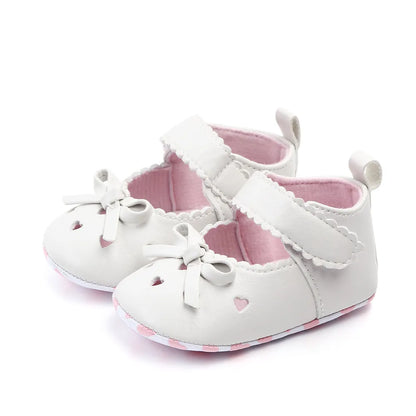 Two pairs of baby girl bow shoes, one pink and one white, soft sole for newborns