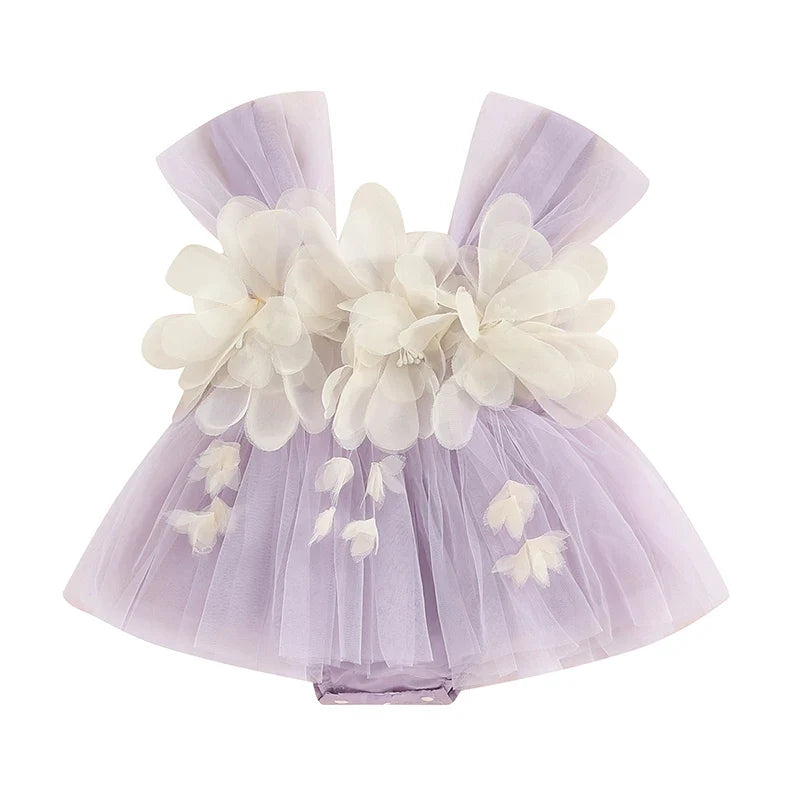 Detailed image of the floral print and tulle skirt on an infant girl's sleeveless romper.