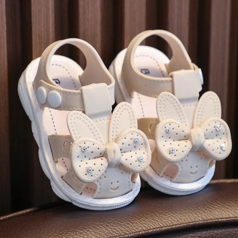 Adorable pink infant girls' sandals featuring a stylish bow, comfortable fit