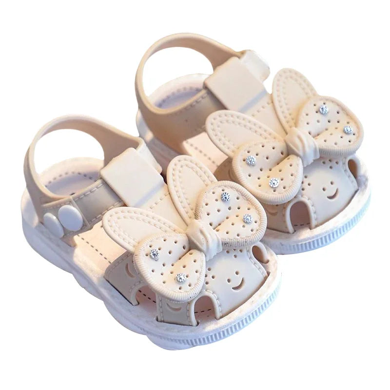 Non-slip infant girls' sandals in pink with bow accen, durable PVC