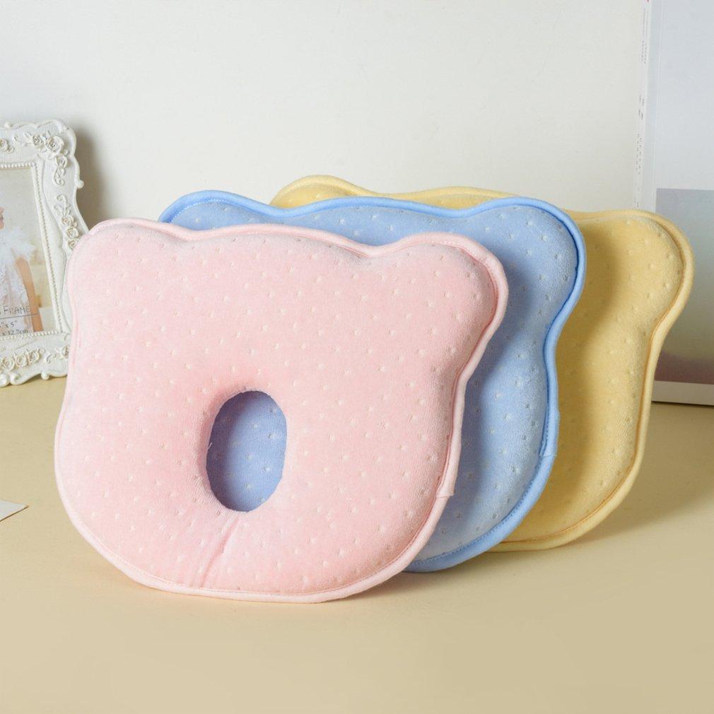 Newborn essentials: Bear-shaped memory foam baby pillow for head shaping and sleep support.