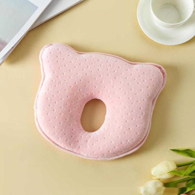 Detailed view of infant memory foam pillow's contoured center for flat head syndrome prevention.