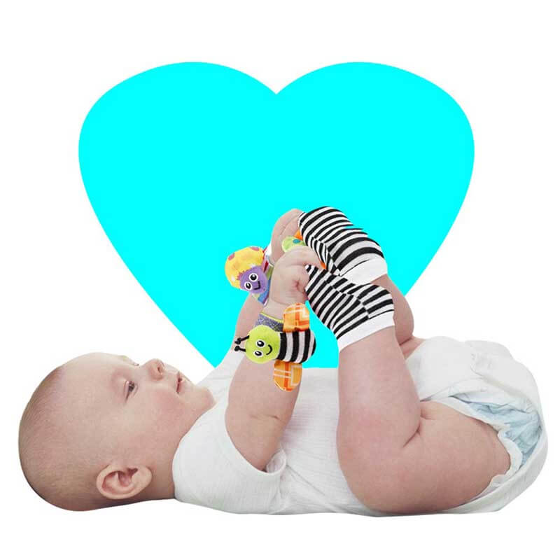 Close-up of baby's foot wearing soft rattle socks, animal themed foot finders for sensory play