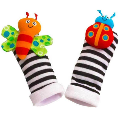 Baby wrist rattle on an infant's arm, plush sensory toy for developmental engagement and play