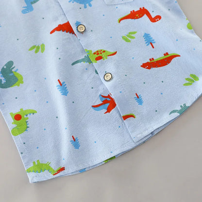 Detail of dinosaur print on baby's short sleeve outfit. High-quality cotton, gentle for infant skin.