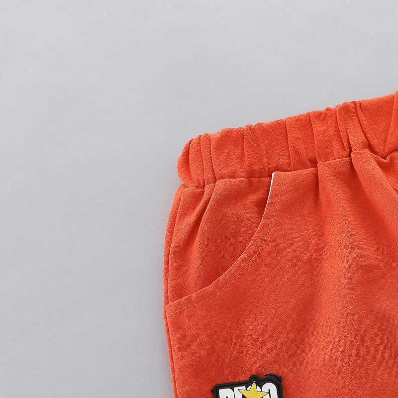 Close up of collar on dinosaur print toddler outfit. Stand-up collar design, short sleeves.