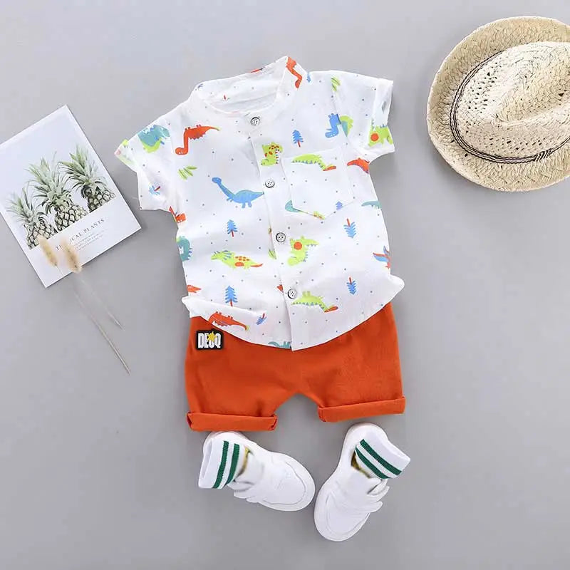 Close-up of dinosaur print on infant toddler short sleeve outfit. Soft cotton fabric, ideal for summer.