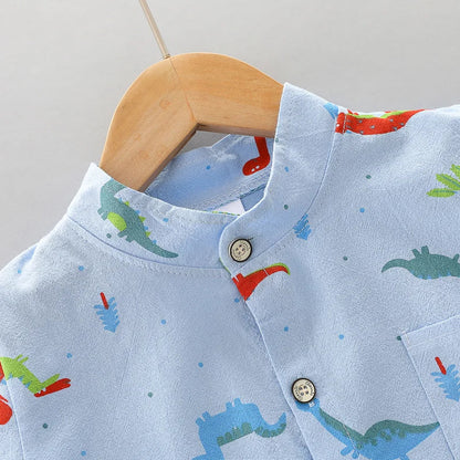Baby boy wearing a vibrant dinosaur print short sleeve outfit set. Comfortable 2-piece infant clothing.