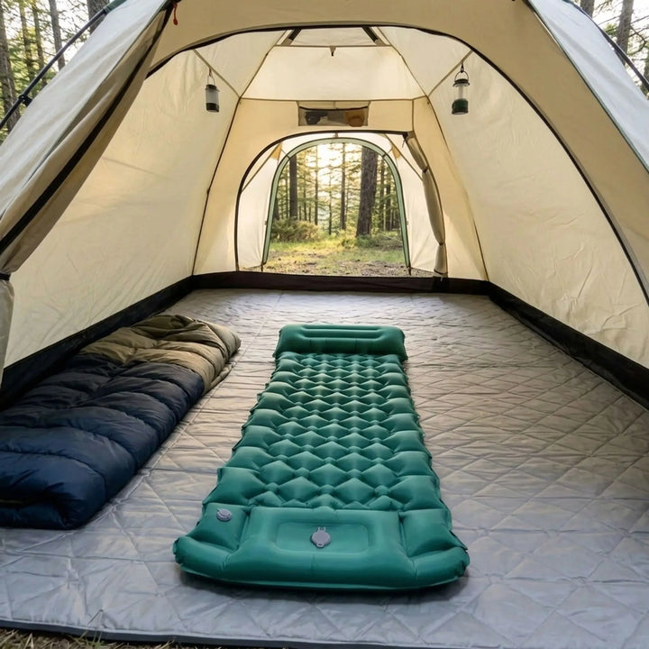 Inflatable camping sleeping pad with built-in pump for easy outdoor setup & comfortable hiking rest.