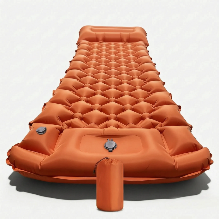 Close-up of the built-in pump on a lightweight camping sleeping pad, demonstrating easy inflation.