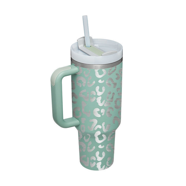 Ergonomic 40 oz insulated travel mug with handle & reusable straw for effortless hydration.