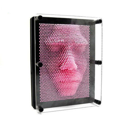 Adult novelty pin art board on a desk, a fun interactive toy and modern home decor accent.