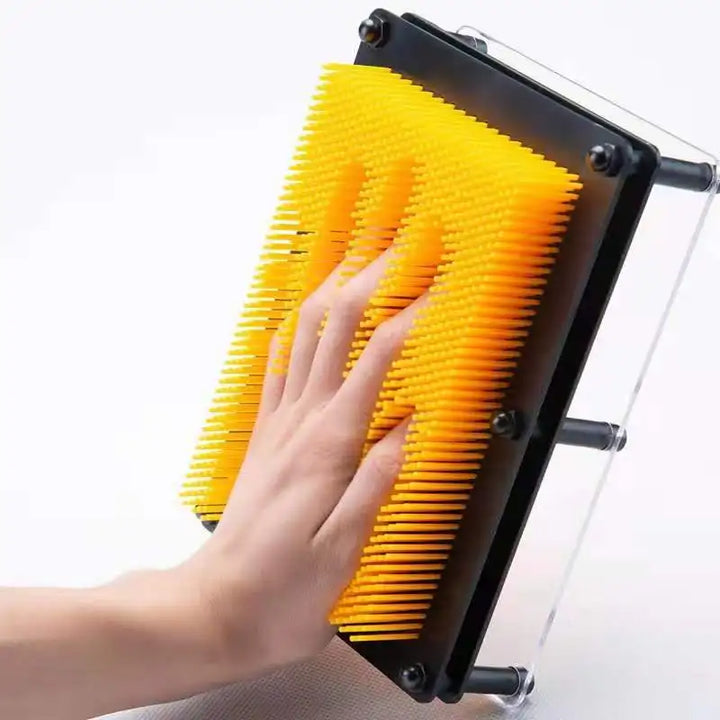 High-angle shot of a pin art board, demonstrating its interactive 3D sculpture capabilities.