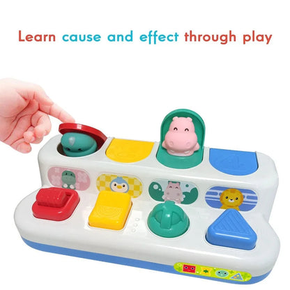 Top-down view of interactive baby toy, highlighting button features and design