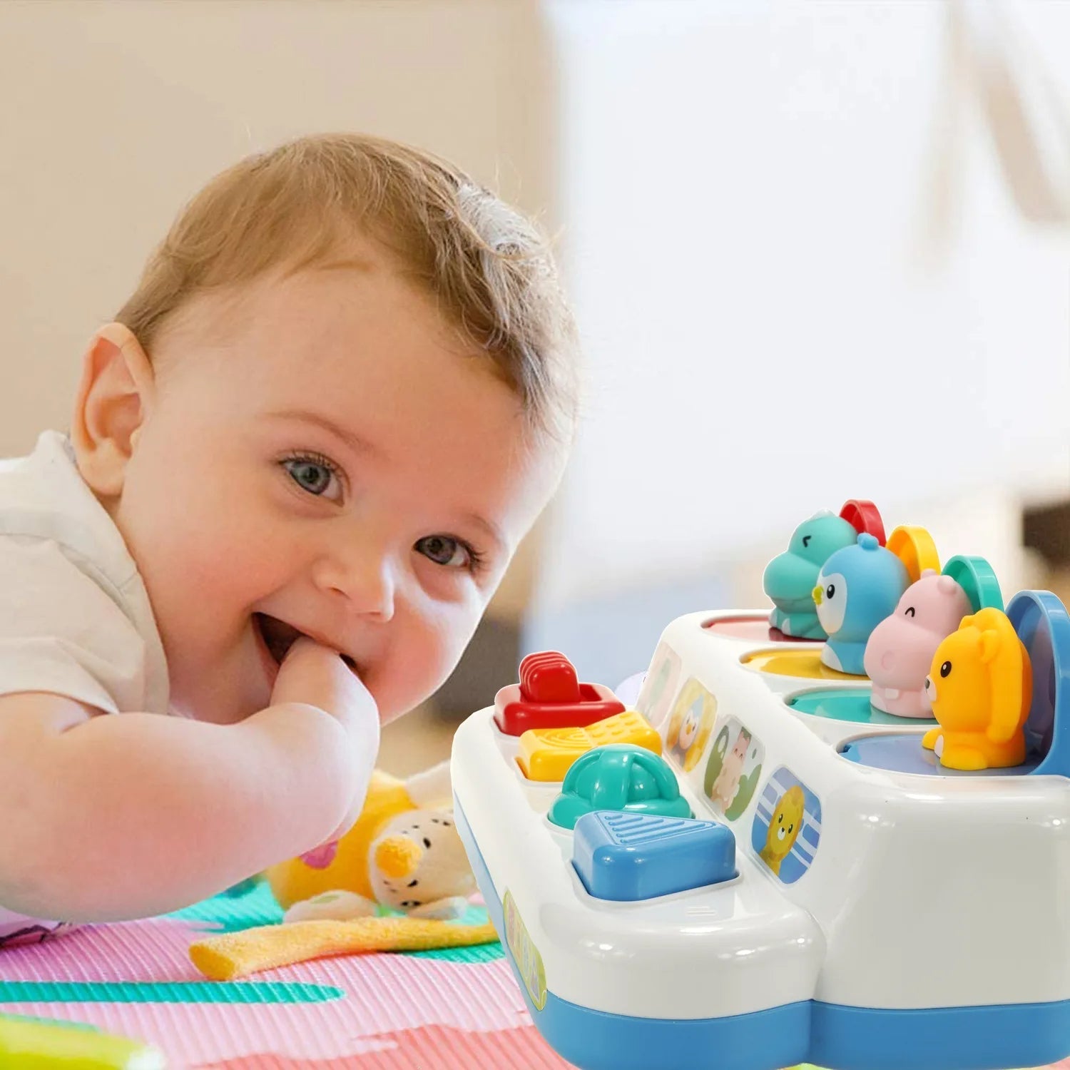 Infant hands exploring an interactive button toy, enhancing cognitive development