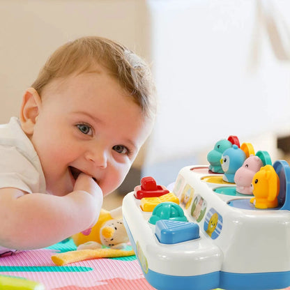 Infant hands exploring an interactive button toy, enhancing cognitive development
