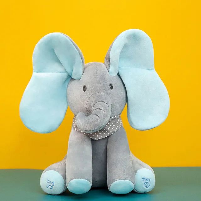 Close-up of a musical elephant plush toy's face, showing soft texture and friendly design.