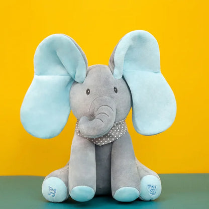Close-up of a musical elephant plush toy's face, showing soft texture and friendly design.