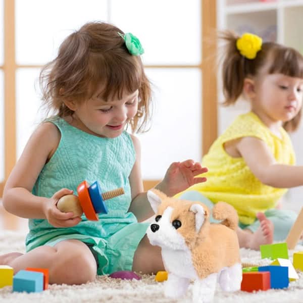 Movable plush dog toy for children's interactive role-play. A soft, stuffed animal playmate.