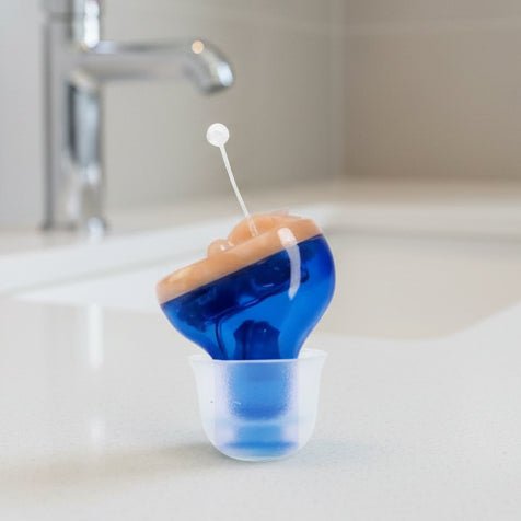 Invisible in-ear hearing aid for crystal clear sound. Discreet personal listening device, comfortable & effective.