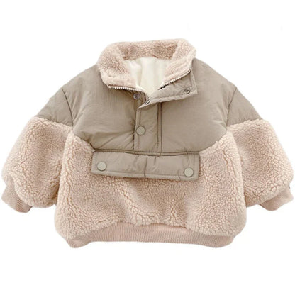 Detail of the fleece texture and lambswool collar on a girls' winter jacket
