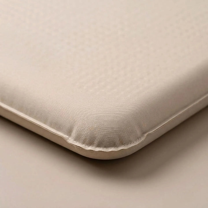 Portable khaki self-inflating sleeping pad, perfect for comfortable outdoor adventures and car camping.