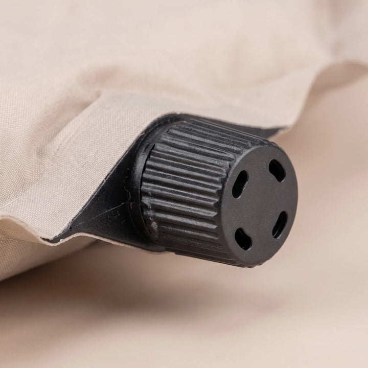 Durable self-inflating camping sleeping pad, designed for comfortable outdoor nights and easy setup.