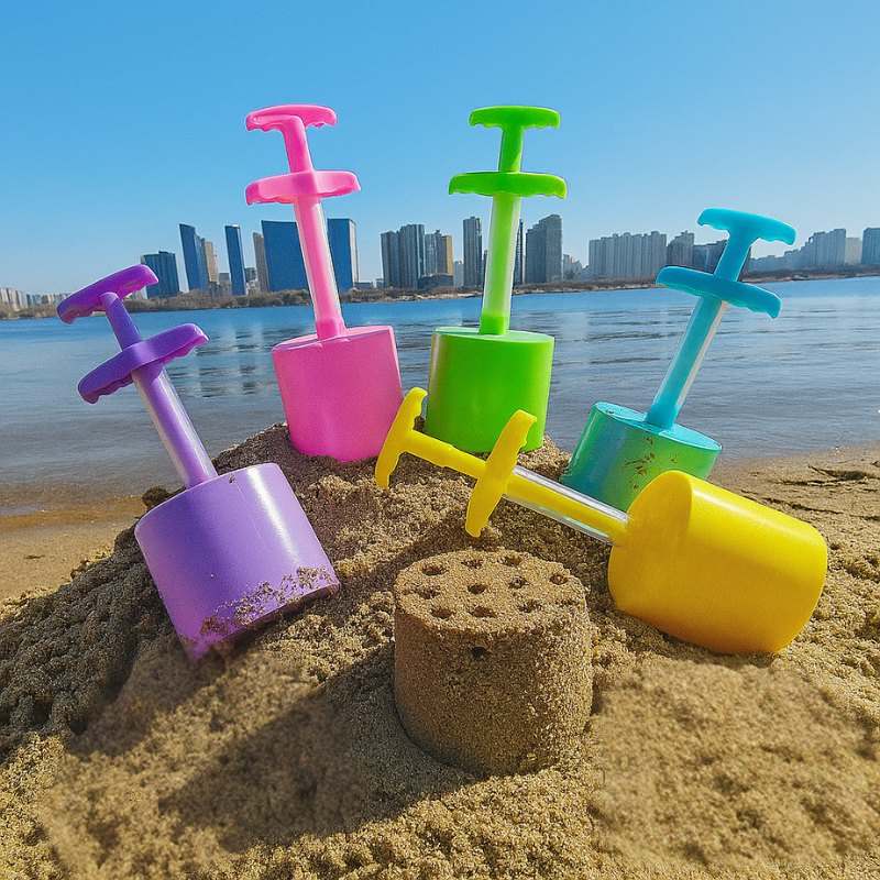 Kid's Creative Sand & Snow Popper Tool in blue & yellow, perfect for building sandcastles & snow forts, promoting outdoor play.